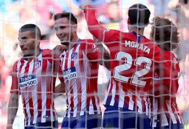 Atletico Madrid 1 -0 Real Valladolid: Joaquin own goal keeps Barcelona waiting