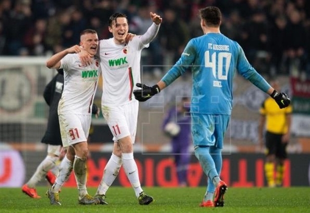 Augsburg 2 -1 Borussia Dortmund: Bavarians boost neighbours Bayern in Bundesliga title race